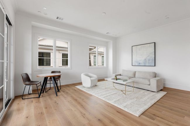 The sliding glass doors to the rooftop terrace encourage indoor/outdoor living, extending the large game room out to the covered patio for year-round enjoyment. | Image 31