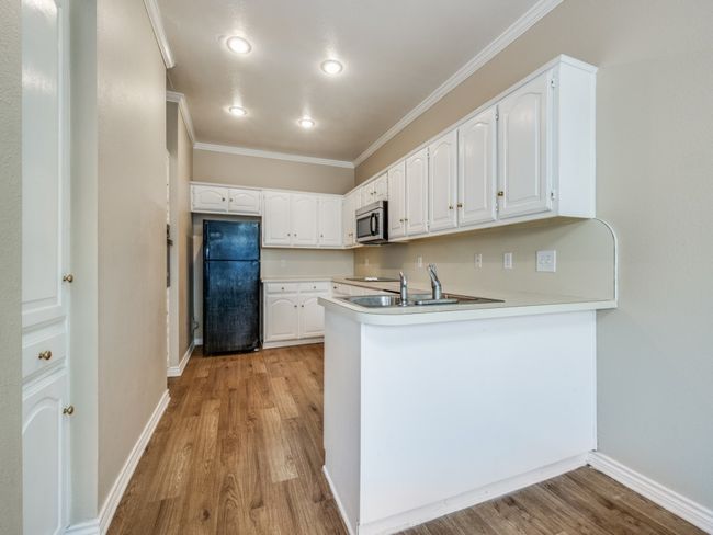 Full kitchen with luxury plank vinyl flooring | Image 9