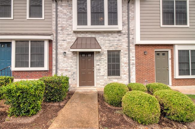 View of exterior entry with brick siding | Image 4