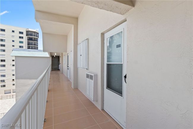 The entry to your unit welcomes you with a secure door opening into a bright and airy living space. | Image 9