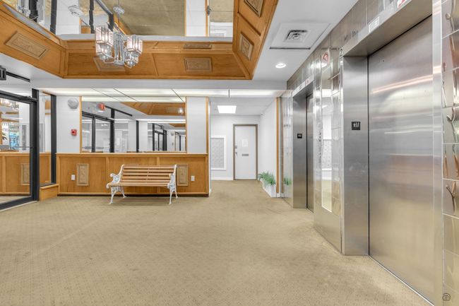 Interior space with elevator, carpet, and visible vents | Image 7
