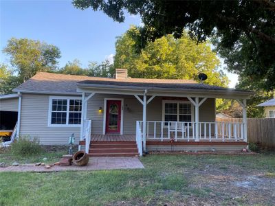 View of front facade featuring a porch | Image 1