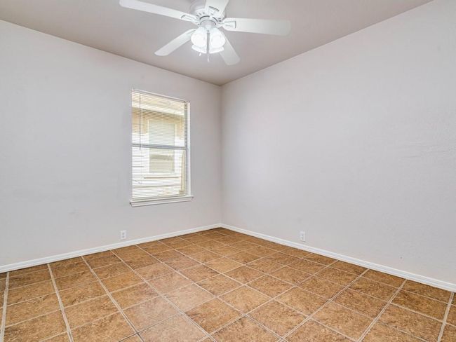 Unfurnished room featuring baseboards and a ceiling fan | Image 22