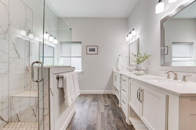 Double vanity in the primary suite with plenty of natural light. | Image 17