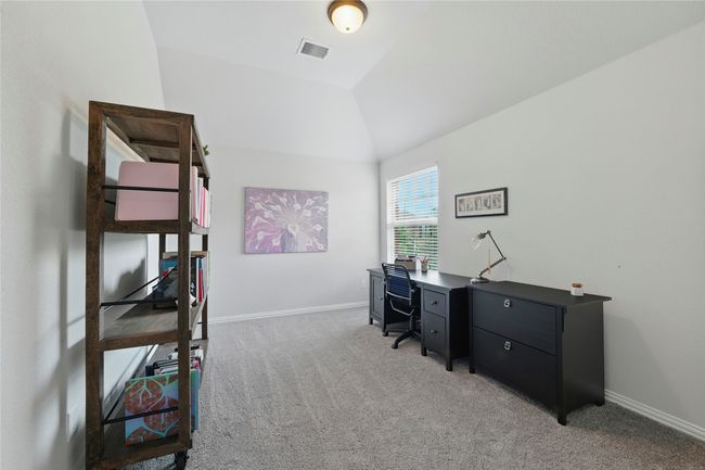 Office space featuring light carpet and lofted ceiling | Image 31