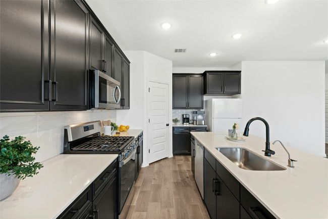 Pantry and nice dark cabinets and white color scheme | Image 6