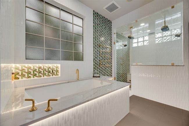 Full remodeled primary bathroom with spectacular features including a therapeutic tub. | Image 11
