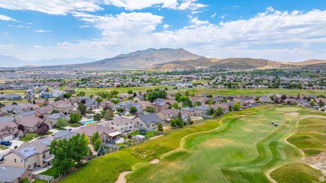 Aerial view of residential area featuring mountains and a golf course | Image 44