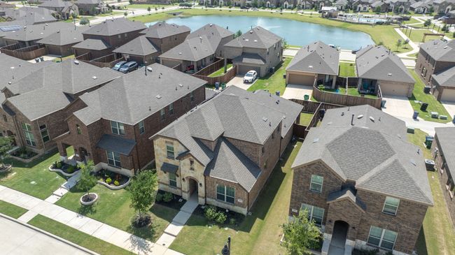 Aerial view of residential area featuring a nearby body of water | Image 32