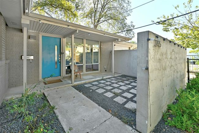 The front porch is sizeable with xeriscape features, making it the perfect place to sit out and enjoy your morning coffee. | Image 6