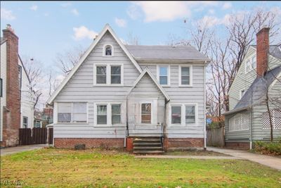 Tudor-style house with a front yard | Image 1