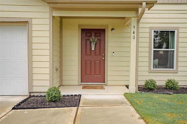 The welcoming covered front entrance with an outside plug to the left for seasonal decorations. Home has a ring doorbell and three exterior cameras that will convey. | Image 4
