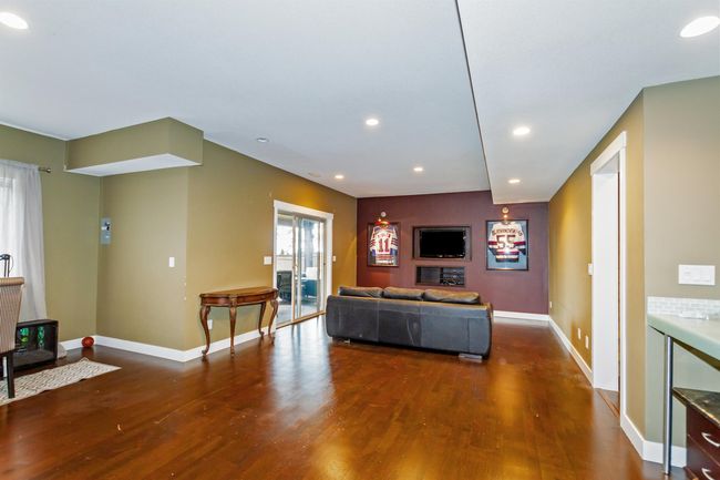 Living room with recessed lighting, baseboards, and wood finished floors | Image 25