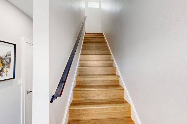 Staircase featuring wood finished floors and baseboards | Image 18