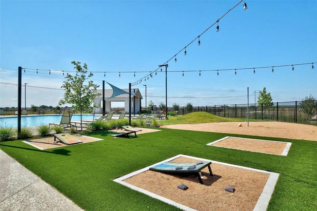 View of home's community with a swimming pool | Image 16