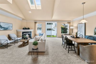 The welcoming entry opens to the great room with vaulted ceilings and a skylight. | Image 3