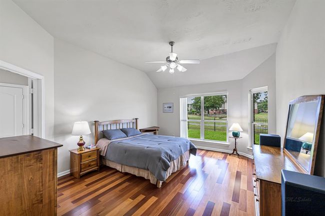 Unwind the day in your spacious primary En-suite with huge windows overlooking the spectacular lakeview in your backyard. | Image 12