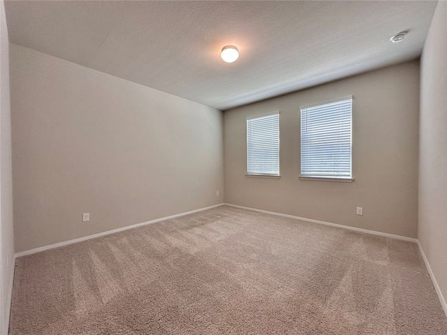Unfurnished room featuring carpet and a smoke detector | Image 11