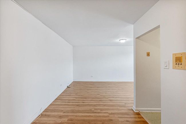 Unfurnished room featuring light wood finished floors and baseboards | Image 6