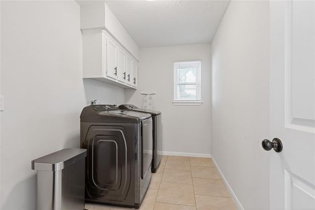 Utility room on first floor near back door. | Image 18