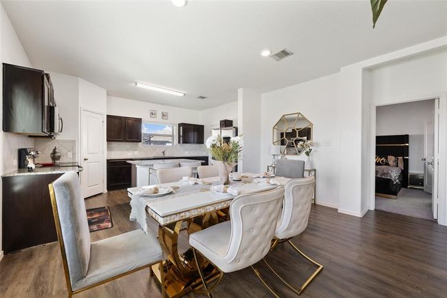 Dining room with dark wood-style flooring, baseboards, and recessed lighting | Image 13