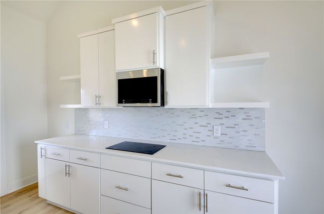 Modern electric cook top and with microwave for meals. | Image 8