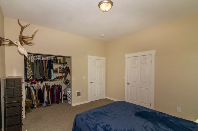 Bedroom featuring carpet and a closet | Image 8