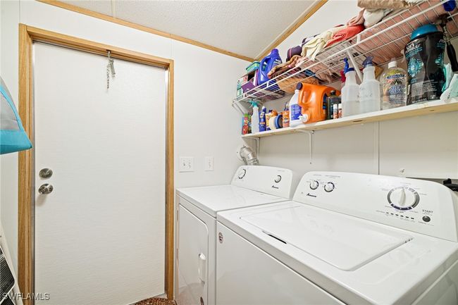 Laundry room featuring washer and dryer | Image 18
