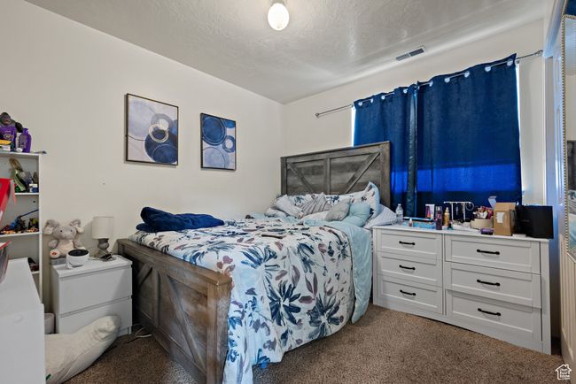 Bedroom with light colored carpet | Image 42