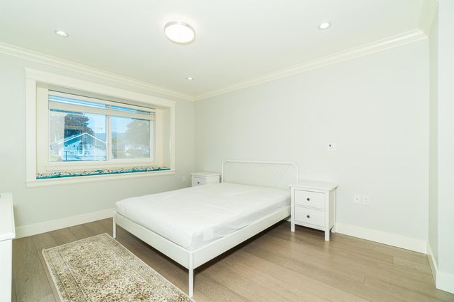 Bedroom featuring ornamental molding, light wood-type flooring, baseboards, and recessed lighting | Image 13