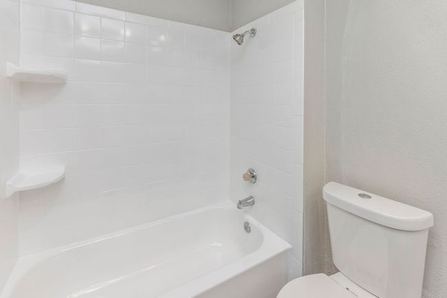 Full bath featuring toilet and bathtub / shower combination | Image 16