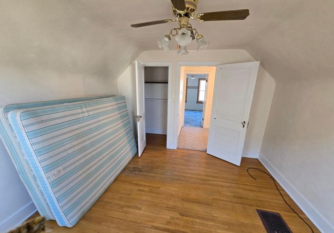 East bedroom with closet & ceiling fan | Image 27
