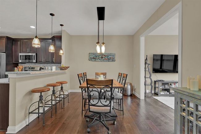 EATING AREA INCLUDES BREAKFAST BAR SEATING! | Image 9