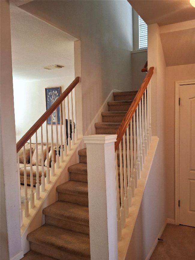 Staircase featuring baseboards, visible vents, and carpet floors | Image 13