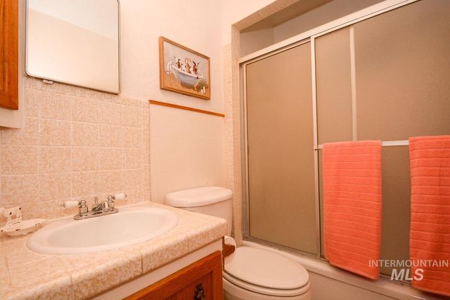 Full bathroom with vanity and tile walls | Image 26