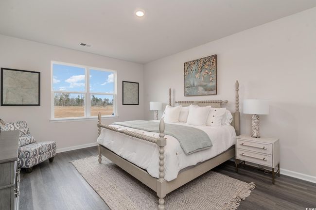 Bedroom with dark wood-style floors and recessed lighting | Image 15