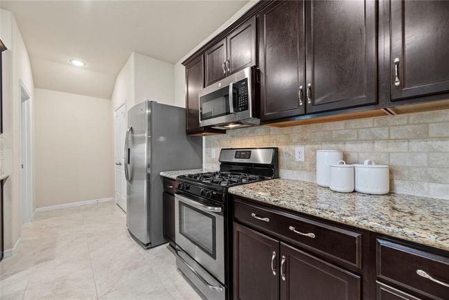 Stainless steel appliances bring a sleek and modern aesthetic to the kitchen, while also offering top-of-the-line performance and durability. | Image 6
