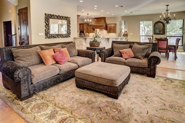 Downstairs living area with views of pool and back yard. | Image 10