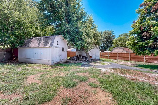 View of yard featuring a storage shed | Image 10