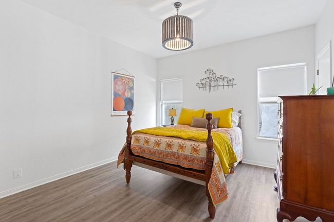 Bedroom with wood finished floors and baseboards | Image 31