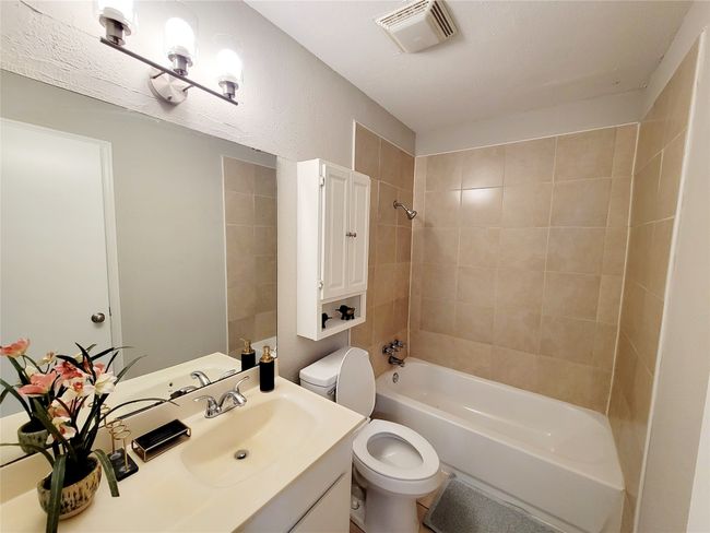 Full bathroom with tiled shower / bath combo, toilet, and​​‌​​​​‌​​‌‌​‌‌​​​‌‌​​‌‌​‌​​​​​‌ vanity | Image 19