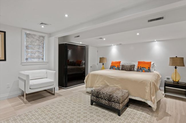Bedroom with recessed lighting and light wood-style flooring | Image 23