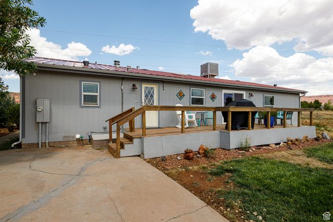 Rear view of house featuring a patio and central AC unit | Image 29