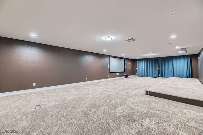 Cinema room with carpet floors and recessed lighting | Image 36