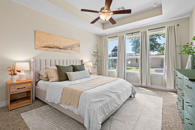 Incredible primary bedroom with large windows letting all the morning light in! | Image 18