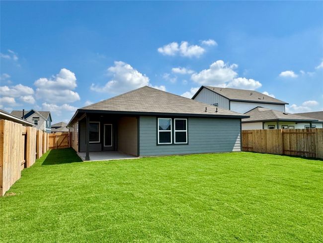 Back of house with a patio area, a fenced backyard, and roof with shingles | Image 5