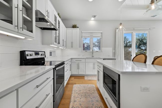 Kitchen facing the backyard | Image 7