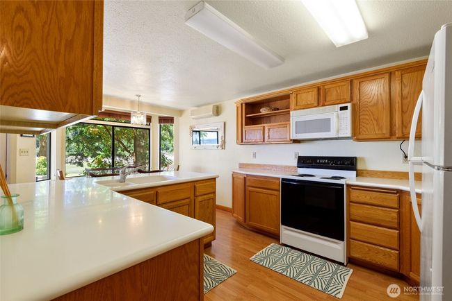 large kitchen with plenty of cabinet and counter space. | Image 10