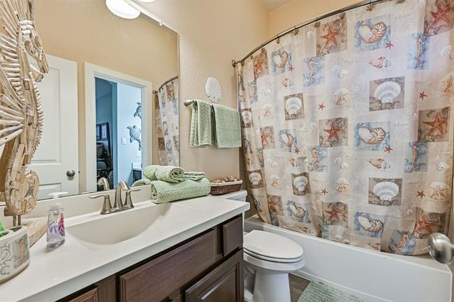 Downstairs hall bath with entry to bedroom | Image 25
