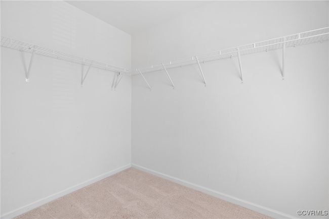 Spacious closet with carpet | Image 28